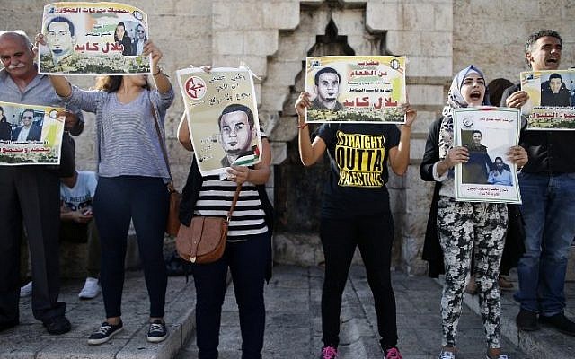 Palestinian protesters hold posters during a demonstration against administrative detention and in support of Palestinian prisoner Bilal Kayed (portraits) on August 24, 2016 at Damascus Gate, a main entrance to Jerusalem's Old City. (AFP PHOTO / AHMAD GHARABLI) Palestinian protesters hold posters during a demonstration against administrative detention and in support of Palestinian prisoner Bilal Kayed (portraits) on August 24, 2016 at Damascus Gate, a main entrance to Jerusalem's Old City. (AFP PHOTO / AHMAD GHARABLI)