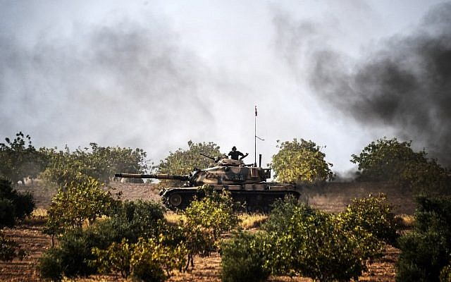 Turkish Army tanks driving to the Syrian Turkish border town of Jarabulus, August 25, 2016. (AFP/BULENT KILIC) Turkish Army tanks driving to the Syrian Turkish border town of Jarabulus, August 25, 2016. (AFP/BULENT KILIC)