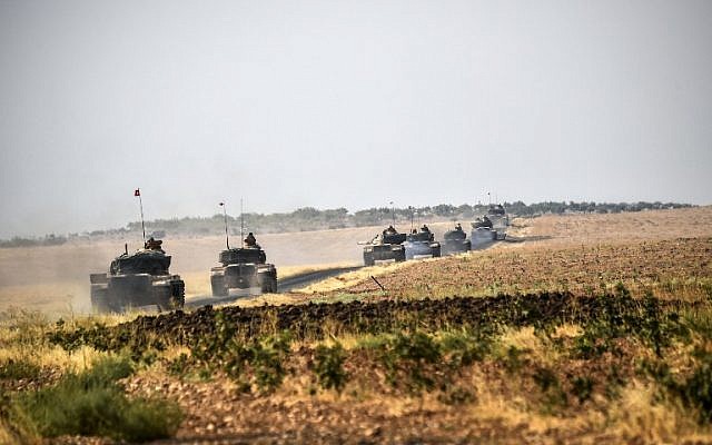 Turkish Army tanks driving to the Syrian Turkish border town of Jarabulus, August 25, 2016. (AFP/BULENT KILIC) Turkish Army tanks driving to the Syrian Turkish border town of Jarabulus, August 25, 2016. (AFP/BULENT KILIC)