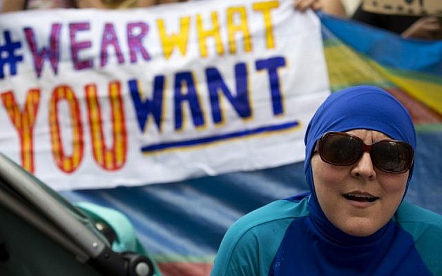 A woman wearing a burkini joins a demonstration outside the French Embassy in London on August 25, 2016, during a 'Wear what you want beach party' to protest the ban on the swimwear on French beaches, and to show solidarity with Muslim women. (AFP PHOTO / JUSTIN TALLIS) A woman wearing a burkini joins a demonstration outside the French Embassy in London on August 25, 2016, during a 'Wear what you want beach party' to protest the ban on the swimwear on French beaches, and to show solidarity with Muslim women. (AFP PHOTO / JUSTIN TALLIS)