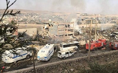 Illustrative photo of Turkish police and firefighters near a damaged police headquarters after a car bomb killed eleven Turkish police officers and injured 45 people on August 26, 2016 in Cizre, southeastern Turkey, an attack blamed on Kurdish militants, state media said. (AFP/Dogan News Agency/STR)