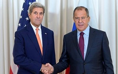 File: US Secretary of State John Kerry, left, shakes hands with Russian Foreign Minister Sergey Lavrov, on August 26, 2016, as they meet in Geneva for an expected push towards resuming peace talks for war-ravaged Syria. (AFP Photo/Pool/Martial Trezzini)