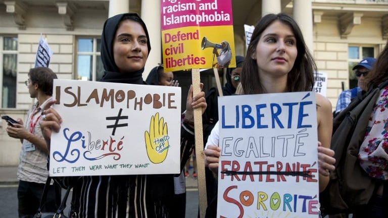 Women join a demonstration organised by "Stand up to Racism" outside the French Embassy in London on August 26, 2016 against the Burkini ban on French beaches. (AFP PHOTO / JUSTIN TALLIS) Women join a demonstration organised by "Stand up to Racism" outside the French Embassy in London on August 26, 2016 against the Burkini ban on French beaches. (AFP PHOTO / JUSTIN TALLIS)