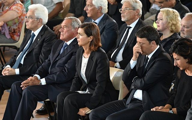 (LtoR) Italian President Sergio Mattarella, Italian Senate President Pietro Grasso, Italian Lower House Speaker Laura Boldrini, Italian Prime Minister Matteo Renzi and his wife Agnese attend a funeral service for victims of the earthquake, at a gymnasium arranged in a chapel of rest on August 27, 2016, in Ascoli Piceno, three days after a 6.2-magnitude earthquake struck the region killing some 290 people. (AFP PHOTO/ALBERTO PIZZOLI)