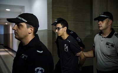 Mourad Hamyd, center, is escorted by police officers, arriving at the courthouse in Sofia, Bulgaria, on August 10, 2016. (AFP/ DIMITAR DILKOFF)
