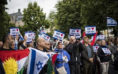 People hold up pro-Israel banners at a 'Taking Back Zionism' rally at Raoul Wallenberg Square in Stockholm on August 28, 2016. (AFP PHOTO/JONATHAN NACKSTRAND)