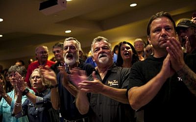 Supporters of Republican presidential candidate Donald Trump cheer as he speaks at the Merrill Auditorium in Portland, Maine on August 4, 2016. (Sarah Rice/Getty Images/AFP)