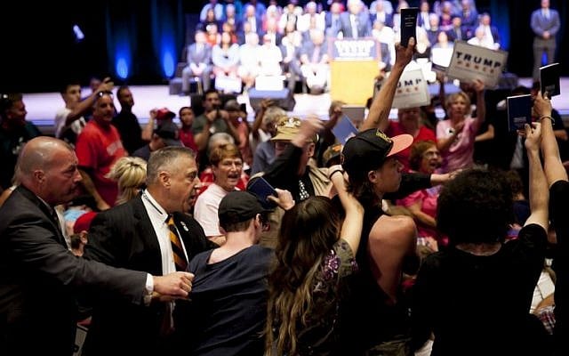 Protesters holding up copies of the Constitution are escorted out of Republican presidential candidate Donald Trump's speech at the Merrill Auditorium in Portland, Maine, on August 4, 2016. (Sarah Rice/Getty Images/AFP) Protesters holding up copies of the Constitution are escorted out of Republican presidential candidate Donald Trump's speech at the Merrill Auditorium in Portland, Maine, on August 4, 2016. (Sarah Rice/Getty Images/AFP)