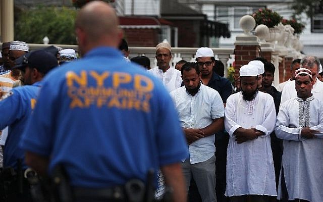 Men pray outside of the Al-Furqan Jame Masjid mosque where Imam Maulama Akonjee and his assistant, Thara Uddin, 64, were killed in a shooting on August 13 in the Queens borough of New York on August 15, 2016 in New York City. Spencer Platt/Getty Images/AFP) Men pray outside of the Al-Furqan Jame Masjid mosque where Imam Maulama Akonjee and his assistant, Thara Uddin, 64, were killed in a shooting on August 13 in the Queens borough of New York on August 15, 2016 in New York City. Spencer Platt/Getty Images/AFP)