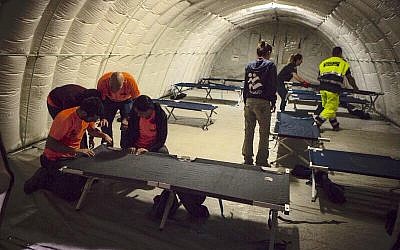 IsraAID volunteers build a temporary shelter for earthquake victims in Scai, Italy. August 27, 2016. (Courtesy) IsraAID volunteers build a temporary shelter for earthquake victims in Scai, Italy. August 27, 2016. (Courtesy)