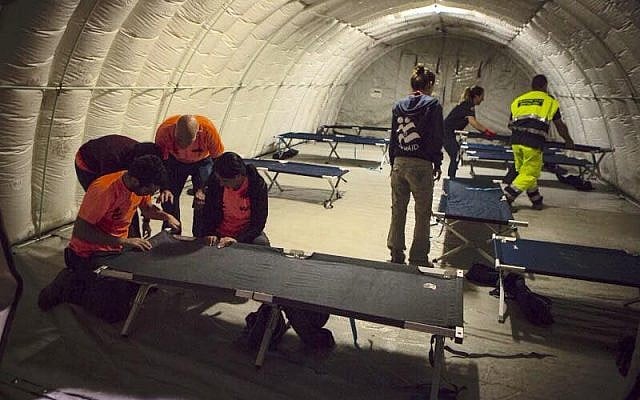 IsraAID volunteers build a temporary shelter for earthquake victims in Scai, Italy. August 27, 2016. (Courtesy) IsraAID volunteers build a temporary shelter for earthquake victims in Scai, Italy. August 27, 2016. (Courtesy)