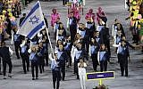 Neta Rivkin carries the flag for the Israeli delegation during the opening ceremony for the 2016 Summer Olympics in Rio de Janeiro, Brazil, Friday, Aug. 5, 2016. (AP Photo/Matt Slocum)