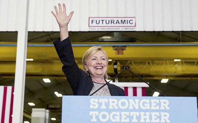 Democratic presidential candidate Hillary Clinton waves as she finishes a speech on the economy after touring Futuramic Tool & Engineering, in Warren, Michigan, Thursday, Aug. 11, 2016. (AP Photo/Andrew Harnik)