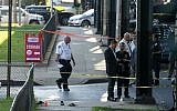 Sandals mark the scene of the crime, not far from the Al-Furqan Jame Masjid Mosque in the Ozone Park neighborhood of Queens, New York, where the leader of a New York City mosque and an associate were fatally shot in a brazen daylight attack, August 13, 2016. (AP/Craig Ruttle)