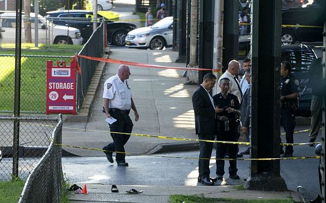 Sandals mark the scene of the crime, not far from the Al-Furqan Jame Masjid Mosque in the Ozone Park neighborhood of Queens, New York, where the leader of a New York City mosque and an associate were fatally shot in a brazen daylight attack, August 13, 2016. (AP/Craig Ruttle) Sandals mark the scene of the crime, not far from the Al-Furqan Jame Masjid Mosque in the Ozone Park neighborhood of Queens, New York, where the leader of a New York City mosque and an associate were fatally shot in a brazen daylight attack, August 13, 2016. (AP/Craig Ruttle)