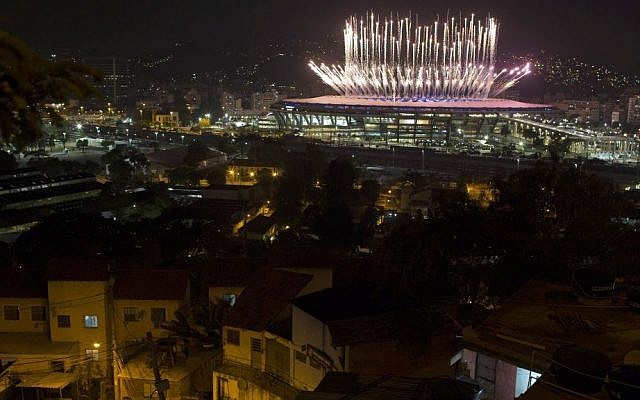 The Mangueira slum is backdropped by fireworks exploding above the Maracana stadium during the opening ceremony of the Rio's 2016 Summer Olympics in Rio de Janeiro in Rio de Janeiro, Brazil, Friday, Aug. 5, 2016. (AP Photo/Leo Correa)