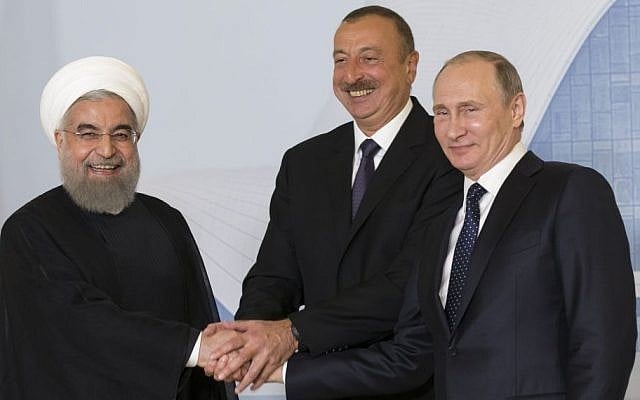 Iranian President Hassan Rouhani, left, Azerbaijan's President Ilham Aliyev, center, and Russian President Vladimir Putin pose for a photo during their meeting in Baku, Azerbaijan, August 8, 2016. (AP/Alexander Zemlianichenko, pool) Iranian President Hassan Rouhani, left, Azerbaijan's President Ilham Aliyev, center, and Russian President Vladimir Putin pose for a photo during their meeting in Baku, Azerbaijan, August 8, 2016. (AP/Alexander Zemlianichenko, pool)