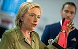 Democratic presidential candidate Hillary Clinton holds up a Donald Trump branded tie, which isn't made in America, as she speaks at Knotty Tie Company in Denver, Colorado, Wednesday, Aug. 3, 2016. (AP Photo/Andrew Harnik)