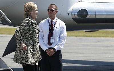 Democratic presidential candidate Hillary Clinton steps from her campaign plane as she arrives at Nantucket Memorial Airport in Nantucket, Massachusetts, Saturday, Aug. 20, 2016 en route to a fundraiser. (AP Photo/Carolyn Kaster)
