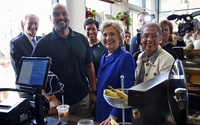 US Democratic presidential candidate Hillary Clinton joined by (from left), Washington City Council member Jack Evans, Uprising Muffin Company owner Donnie Simpson, Washington Mayor Muriel Bowser and Del. Eleanor Holmes Norton, D-D.C., at the muffin store in Washington, DC, on June 10, 2016. (AP/Alex Brandon, File) US Democratic presidential candidate Hillary Clinton joined by (from left), Washington City Council member Jack Evans, Uprising Muffin Company owner Donnie Simpson, Washington Mayor Muriel Bowser and Del. Eleanor Holmes Norton, D-D.C., at the muffin store in Washington, DC, on June 10, 2016. (AP/Alex Brandon, File)