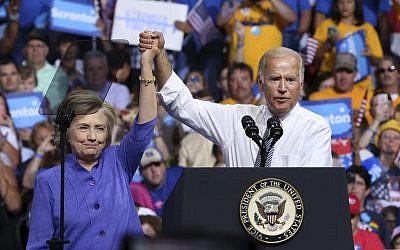 Democratic presidential candidate Hillary Clinton and Vice President Joe Biden hold hands in the air during a campaign rally, Monday, Aug. 15, 2016, in Scranton, Pa. (AP Photo/Mel Evans)