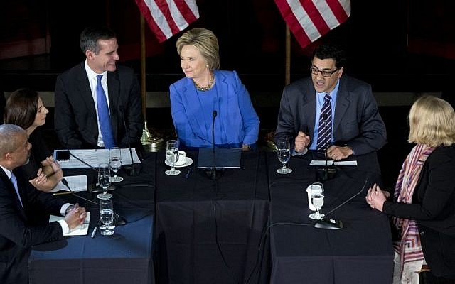 In this March 24, 2016 file photo, Democratic presidential candidate Hillary Clinton looks at Los Angeles Mayor Eric Garcetti, third from left, as she participates in a roundtable with Muslim community leaders at the University of Southern California in Los Angeles. Seated with Clinton from left are City of Los Angeles General Manager, Emergency Management Department James Featherstone, Senior Policy Analyst City of Los Angeles Human Relations Commission & Adjunct Assistant Professor (CSUDH) Joumana Silyan-Saba, Garcetti, President of the Muslim Public Affairs Council, Salam Al-Marayati, and Executive Director of the Center for Religion and Civic Culture Brie Jeanette Loskota. (AP/Carolyn Kaster)