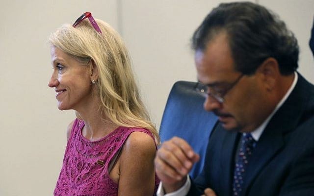 Kellyanne Conway, left, campaign manager for Republican presidential candidate Donald Trump, attends his Hispanic advisory roundtable meeting in New York, Saturday, Aug. 20, 2016. At right is Rick Figueroa, first vice president for FINC Firm of Houston. (AP Photo/Gerald Herbert)