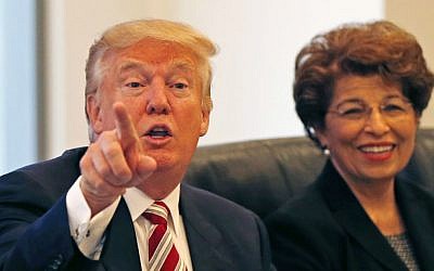 Republican presidential candidate Donald Trump holds a Hispanic advisory roundtable meeting in New York, Saturday, Aug. 20, 2016. At right is Jovita Carranza, former Small Business Administration deputy administrator. (AP Photo/Gerald Herbert)