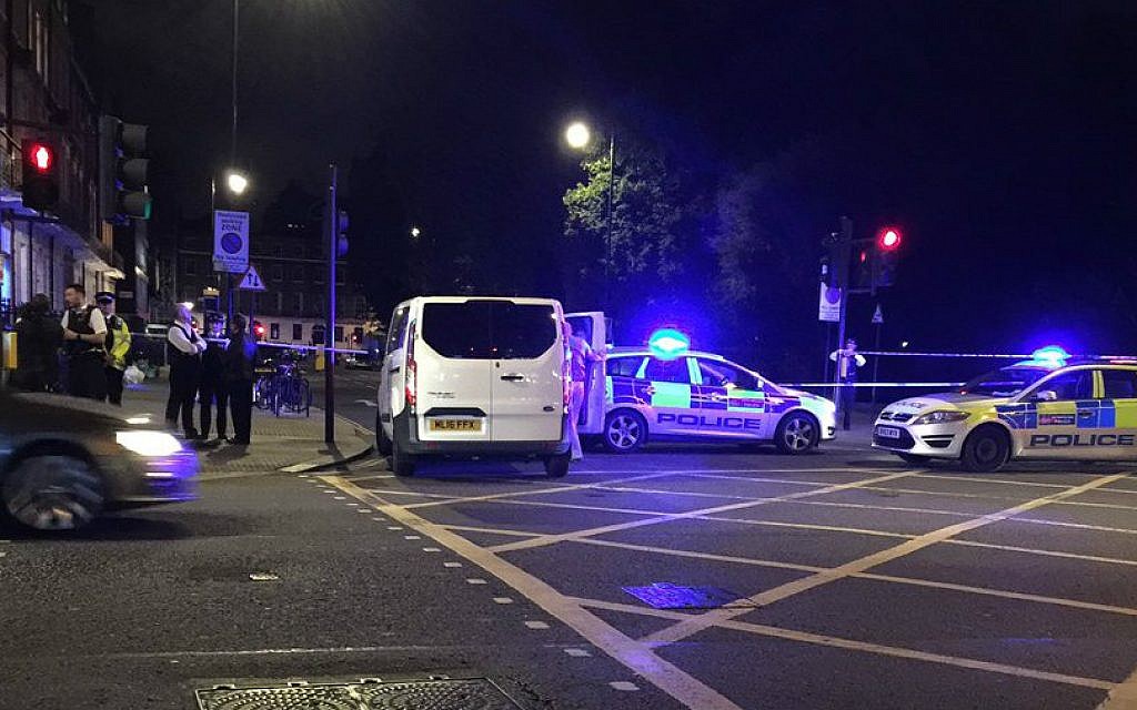 Police at London's Russell Square early Thursday, August 4, 2016 after a stabbing spree left one woman dead and at least six people injured. (Twitter screen capture)