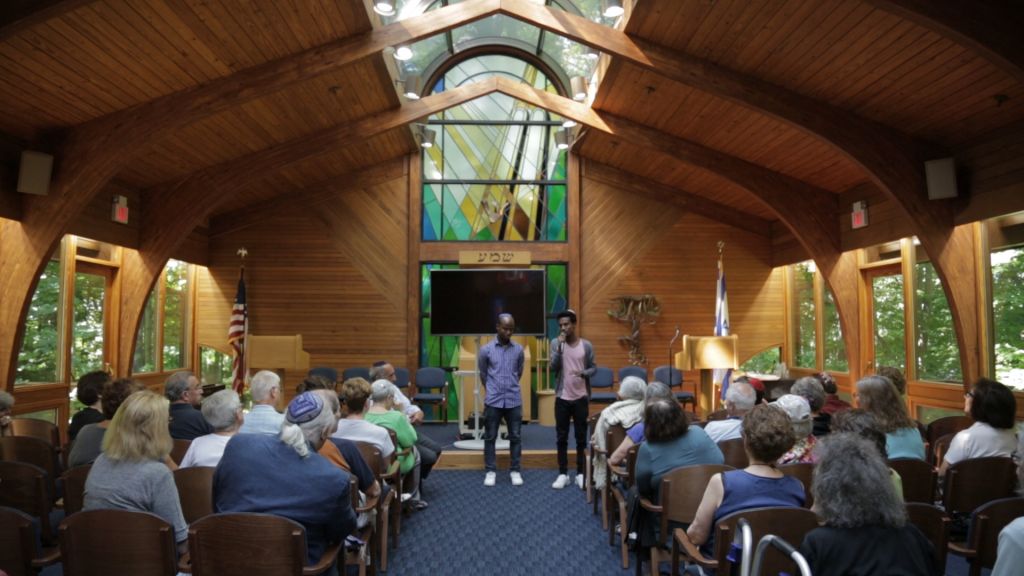 Gezahegn Dereve and Demoz Deboch at Congregation Kol Ami in July, 2016. They say people who hear their presentation are generally confused, then angry, then want to help. (courtesy Ryan Porush)