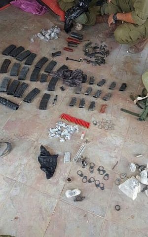 Ammunition, magazines and other military equipment discovered by IDF troops in Khirbat Abu Lahm, northwest of Jerusalem, during a raid on August 10, 2016. (IDF Spokesperson's Unit)