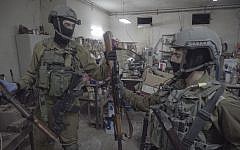 IDF soldiers, along with the police and Shin Bet security service, seize dozens of illegal weapons in Bethlehem and Hebron on August 23, 2016, as part of a large crackdown effort on illicit guns in the West Bank. (IDF Spokesperson's Unit)