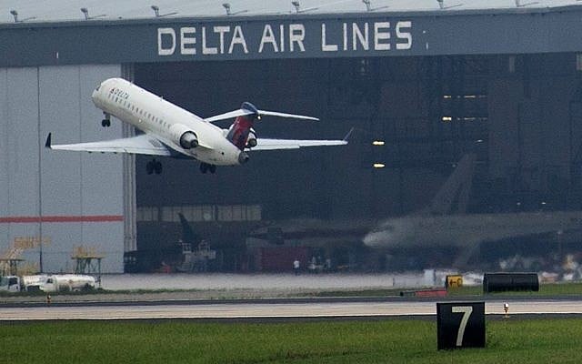 A Delta Air Lines plane takes off at Atlanta's Hartsfield International Airport in Atlanta, Monday, Aug. 8, 2016. (AP Photo/Branden Camp)