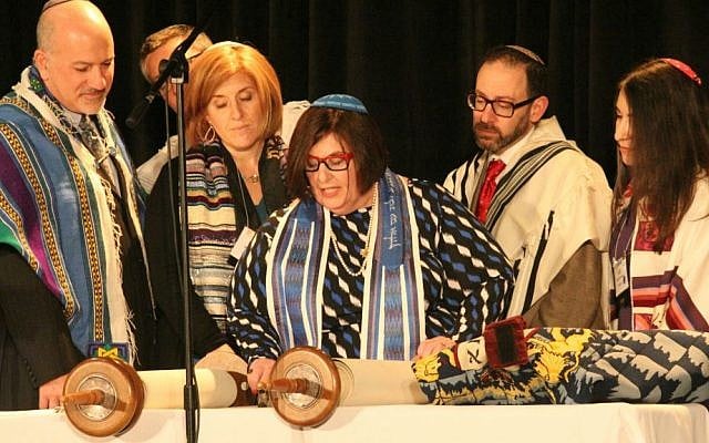 Rabbi Denise Eger, a contributor to 'The Sacred Calling,' center, reading Torah during her installation as CCAR president, March 16, 2015. (David A.M. Wilensky) Rabbi Denise Eger, a contributor to 'The Sacred Calling,' center, reading Torah during her installation as CCAR president, March 16, 2015. (David A.M. Wilensky)