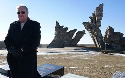 Nazi hunter Efraim Zuroff saying Kaddish, a mourning prayer, for Holocaust victims near Kaunas, Lithuania, February 15, 2015. (Cnaan Liphshiz/JTA)
