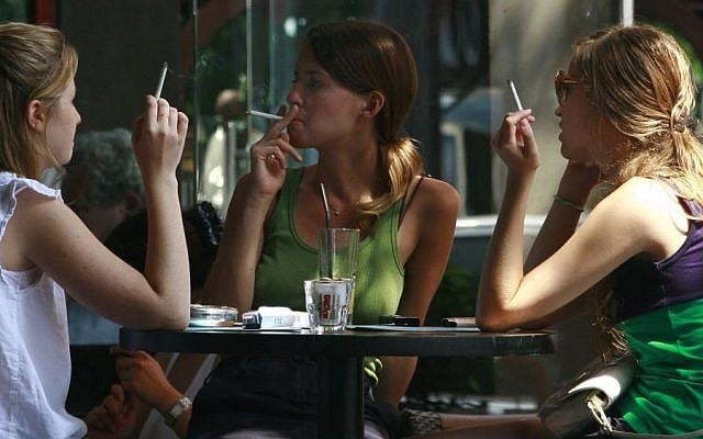 Israeli women smoke cigarettes while spending time at a cafe in central Tel Aviv. (Kobi Gideon / FLASH90) Israeli women smoke cigarettes while spending time at a cafe in central Tel Aviv. (Kobi Gideon / FLASH90)