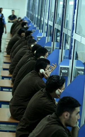 Security prisoners during a visiting session in the Ofer Prison facility near Ramallah, August 20, 2008. (Moshe Shai/Flash90)
