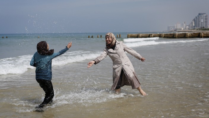 .Young Palestinian women from the West Bank town of Bethlehem play on the beach in Tel Aviv on March 23, 2014. (Miriam Alster/Flash90) Young Palestinian women from the West Bank town of Bethlehem play on the beach in Tel Aviv on March 23, 2014. (Miriam Alster/Flash90)