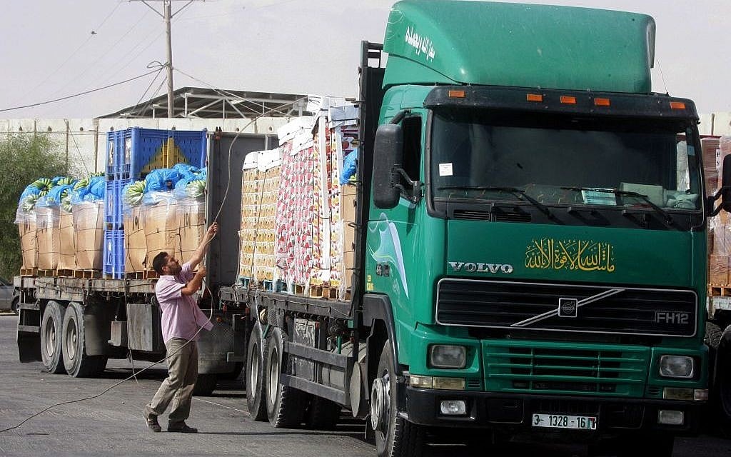 Trucks loaded with aid enter the Gaza Strip from Israel through the Kerem Shalom crossing on October 12, 2014, in Rafah in southern Gaza. (Abed Rahim Khatib/Flash90) Trucks loaded with aid enter the Gaza Strip from Israel through the Kerem Shalom crossing on October 12, 2014, in Rafah in southern Gaza. (Abed Rahim Khatib/Flash90)
