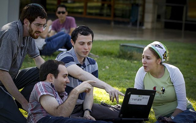 Students sitting on the grass at Hebrew University of Jerusalem's Givat Ram campus on October 27, 2014. (Miriam Alster/Flash90) Students sitting on the grass at Hebrew University of Jerusalem's Givat Ram campus on October 27, 2014. (Miriam Alster/Flash90)