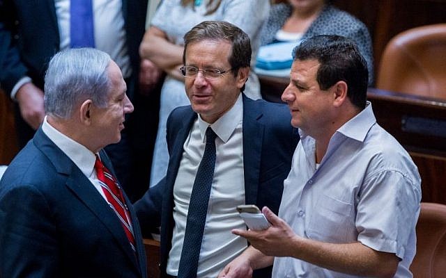 In this undated photo, Prime Minister Benjamin Netanyahu (L) speaks with Leader of the Zionist Union party Isaac Herzog (C) and Leader of the Joint (Arab) List, Ayman Odeh in the Knesset. (Yonatan Sindel/Flash90) In this undated photo, Prime Minister Benjamin Netanyahu (L) speaks with Leader of the Zionist Union party Isaac Herzog (C) and Leader of the Joint (Arab) List, Ayman Odeh in the Knesset. (Yonatan Sindel/Flash90)