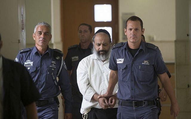 Alon Shamir, a 50-year-old therapist accused of raping two of his patients, is escorted by prison service guards at the District court as he arrives for a court hearing in Jerusalem on August 7, 2016, (Yonatan Sindel/Flash90) Alon Shamir, a 50-year-old therapist accused of raping two of his patients, is escorted by prison service guards at the District court as he arrives for a court hearing in Jerusalem on August 7, 2016, (Yonatan Sindel/Flash90)