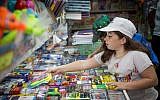 Israelis buying school supplies for the upcoming school year starting in September, at a store in Jerusalem, on August 24, 2016. (Hadas Parush/Flash90)