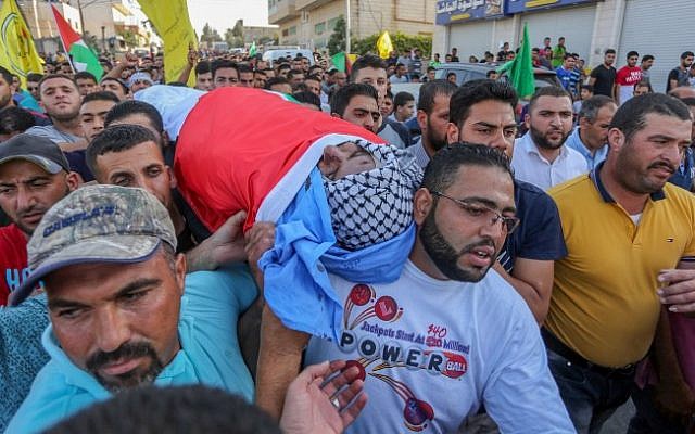 Palestinian mourners carry the body of 38-year-old Iyad Hamad, during his funeral in the West Bank village of Silwad, August 26, 2016. Flash90) Palestinian mourners carry the body of 38-year-old Iyad Hamad, during his funeral in the West Bank village of Silwad, August 26, 2016. Flash90)