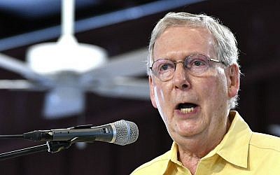 Senate Republican Leader Mitch McConnell of Kentucky addresses the crowd gathered at the Fancy Farm Picnic, Saturday, Aug. 6, 2016 in Fancy Farm, Kentucky. (AP Photo/Timothy D. Easley)