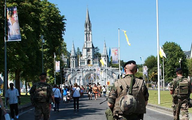 French soldiers patrol in the site of the sanctuary in Lourdes, southwestern France, Sunday Aug.14, 2016. (AP Photo/Bob Edme)