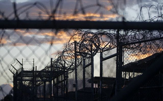 In this Nov. 21, 2013 file photo reviewed by the US military, dawn arrives at the now closed Camp X-Ray, which was used as the first detention facility for al-Qaeda and Taliban militants who were captured after the September 11 attacks, at the Guantanamo Bay Naval Base, Cuba. (AP/Charles Dharapak) In this Nov. 21, 2013 file photo reviewed by the US military, dawn arrives at the now closed Camp X-Ray, which was used as the first detention facility for al-Qaeda and Taliban militants who were captured after the September 11 attacks, at the Guantanamo Bay Naval Base, Cuba. (AP/Charles Dharapak)