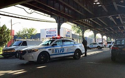 File: New York City police secure a crime scene in the Queens borough of New York, Saturday, Aug. 13, 2016. (AP Photo/Jennifer Peltz)