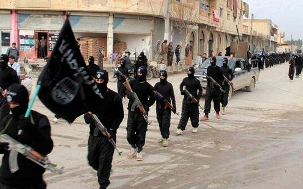 Fighters from the Islamic State group marching in Raqqa, Syria, January 14, 2014. (Militant photo via AP, File) Fighters from the Islamic State group marching in Raqqa, Syria, January 14, 2014. (Militant photo via AP, File)