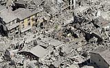 Rescuers search amid rubble following an earthquake in Amatrice Italy, Wednesday, August 24, 2016. (AP Photo/Gregorio Borgia)